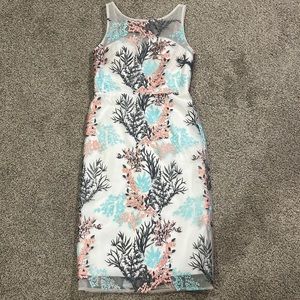 White dress with pink, blue, dark gray detailed pattern